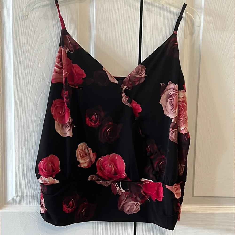 V neck, string sleeves with waistband and elastic around waist.